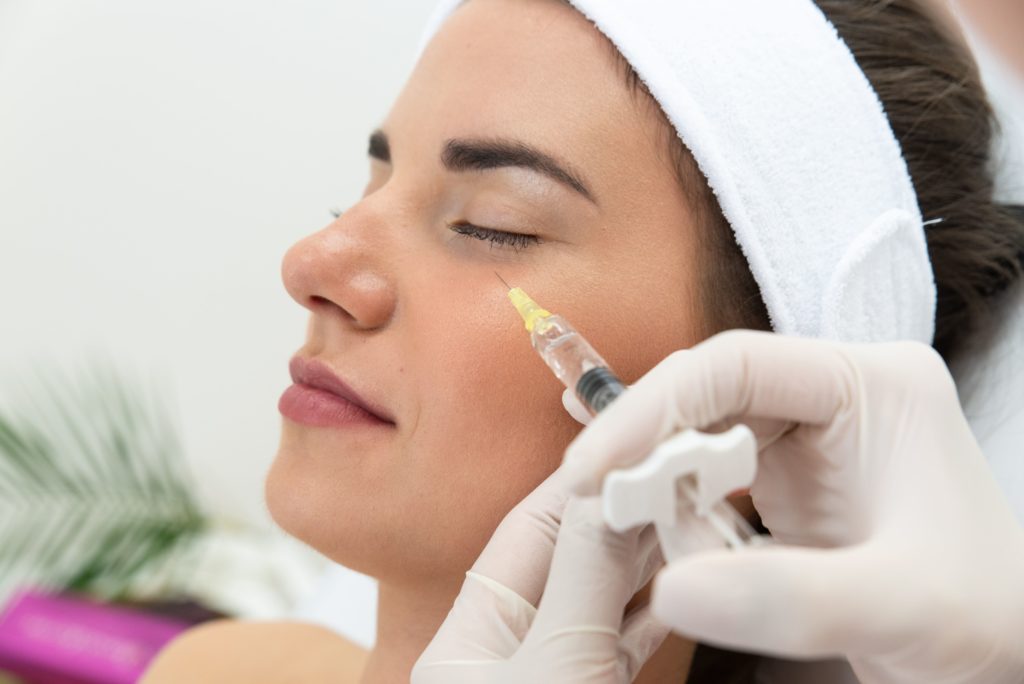 A Woman getting injectable on her face | Get Juvederm treatment in A Nu U Aesthetics at Congers, New York