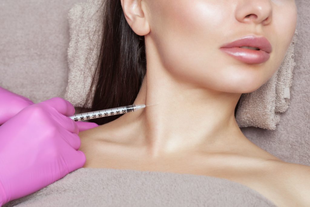 Woman taking Injection to Neck | Get Injectable treatment at A Nu U Aesthetics | Congers, New York