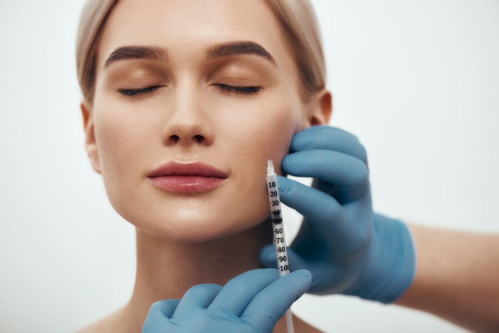 A Woman taking Injection to face | Get Sculptra in A Nu U Aesthetics at Congers, New York